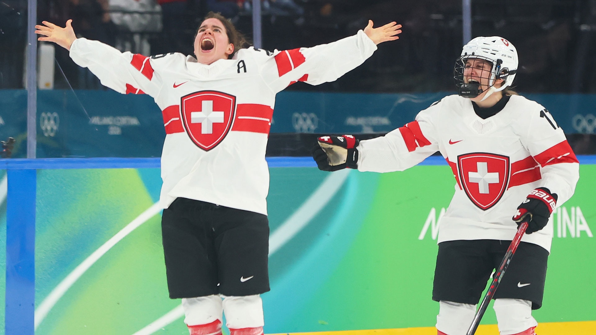 Alina Muller of Switzerland celebrates after scoring the game winning goal to earn the bronze medal during the women's bronze medal match with Sweden at the Milan Cortina 2026 Winter Olympic Games at Milano Santagiulia Ice Hockey Arena on February 19, 2026 in Milan, Italy.