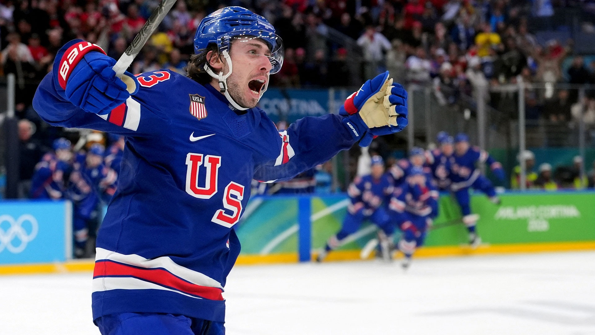 Quinn Hughes of Team UA celebrates his winning goal in overtime against Sweden in a men's ice hockey quarterfinal during the Milan Cortina 2026 Olympic Winter Games at Milano Santagiulia Ice Hockey Arena.