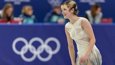Alysa Liu smiles after her program