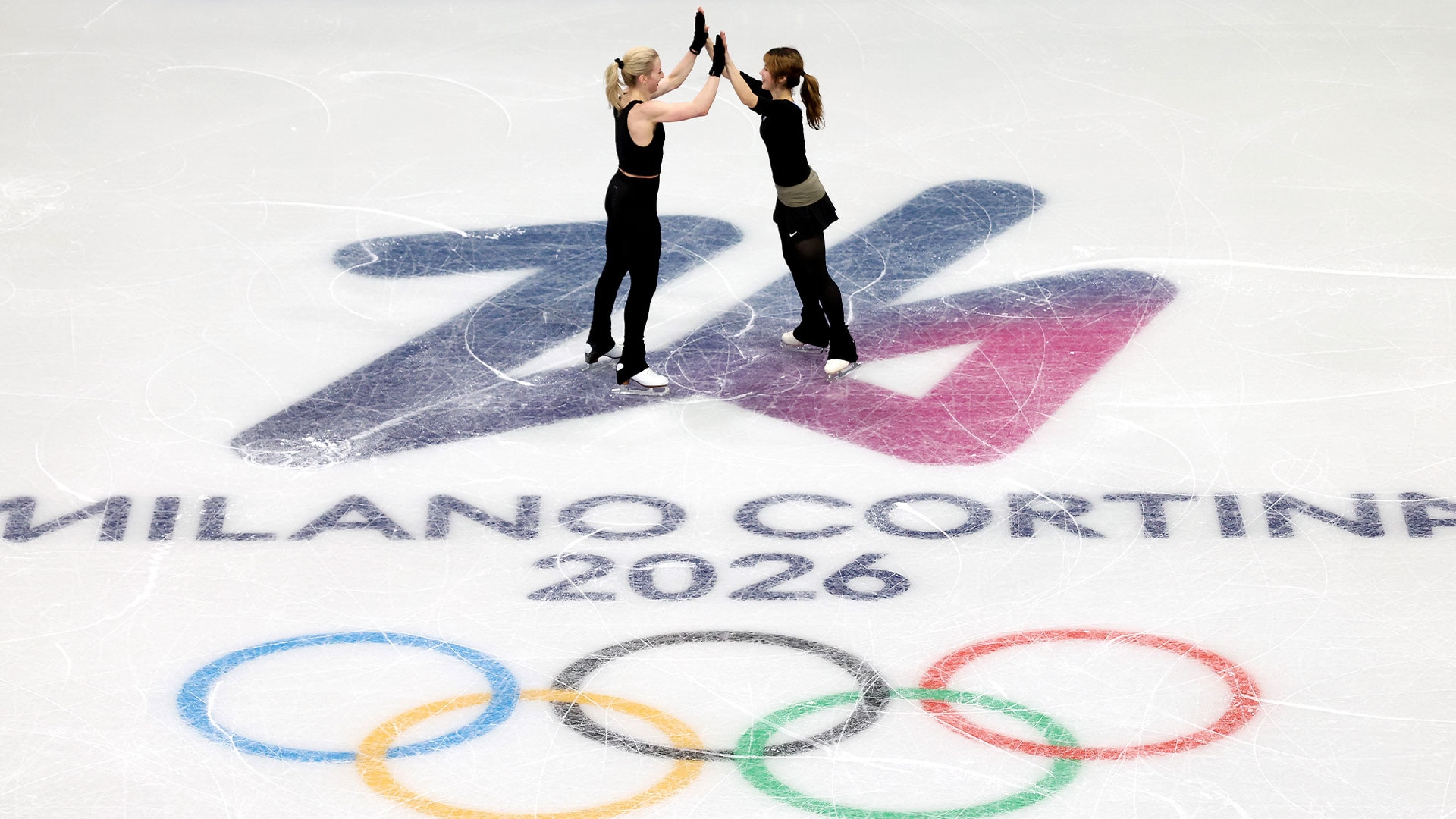Amber Glenn and Alysa Liu high five