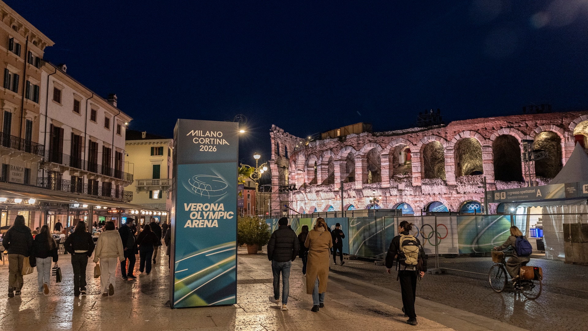 People walk past Verona Olympic Arena on day twelve of the Milan Cortina 2026 Games. 