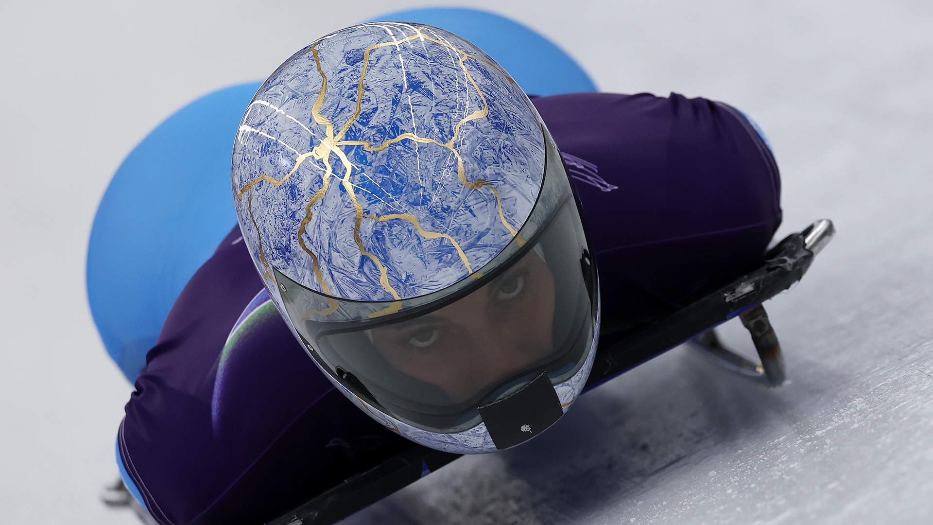 Close-up of Alessandra Fumagalli's light blue and gold helmet