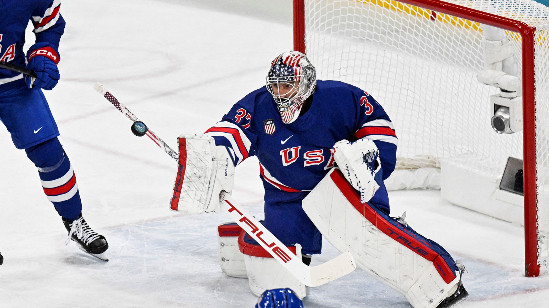 USA's goalkeeper #37 Connor Hellebuyck makes a save during the men's playoff quarterfinal ice hockey match between USA and Sweden at the Milano Santagiulia Ice Hockey Arena during the Milan Cortina 2026 Winter Olympic Games in Milan, on February 18, 2026.