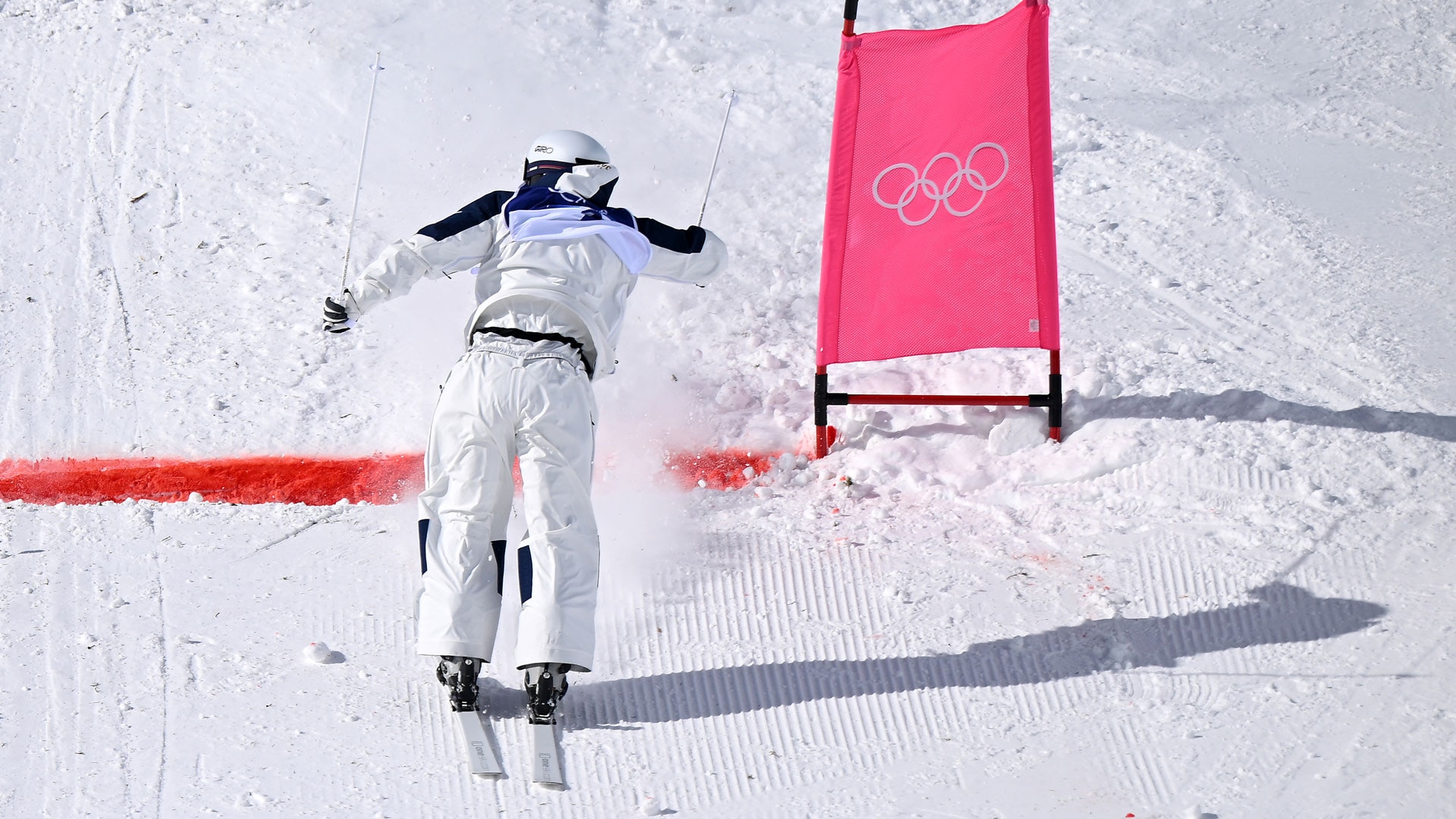 Ikuma Horishima finishes his run backwards during the men's dual moguls quarterfinals in Livigno, Italy.