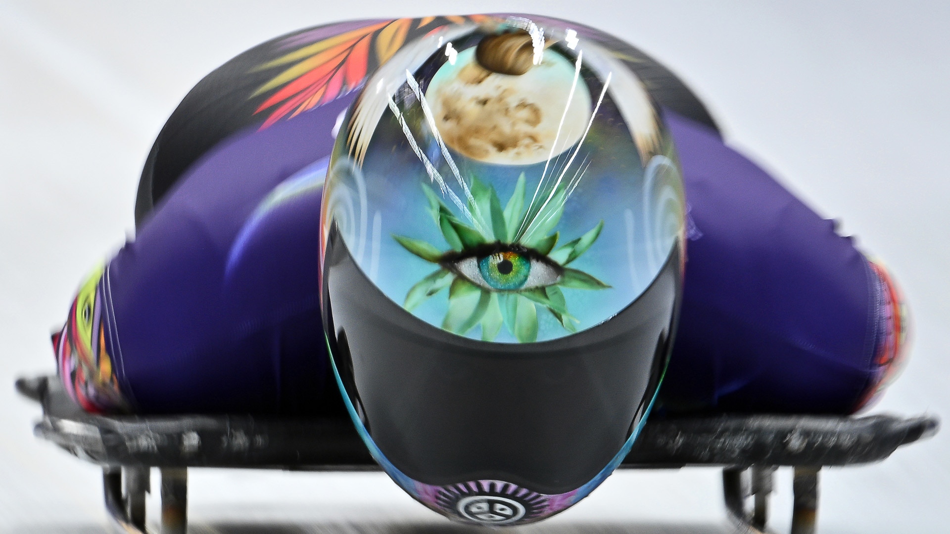 Close-up of Kellie Delka's helmet with a single eye