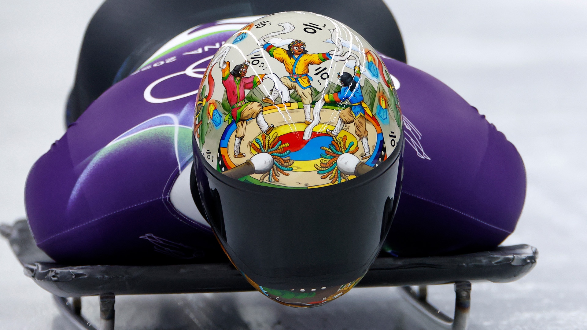 Close-up of Kim Jisoo's helmet depicting Korean dance