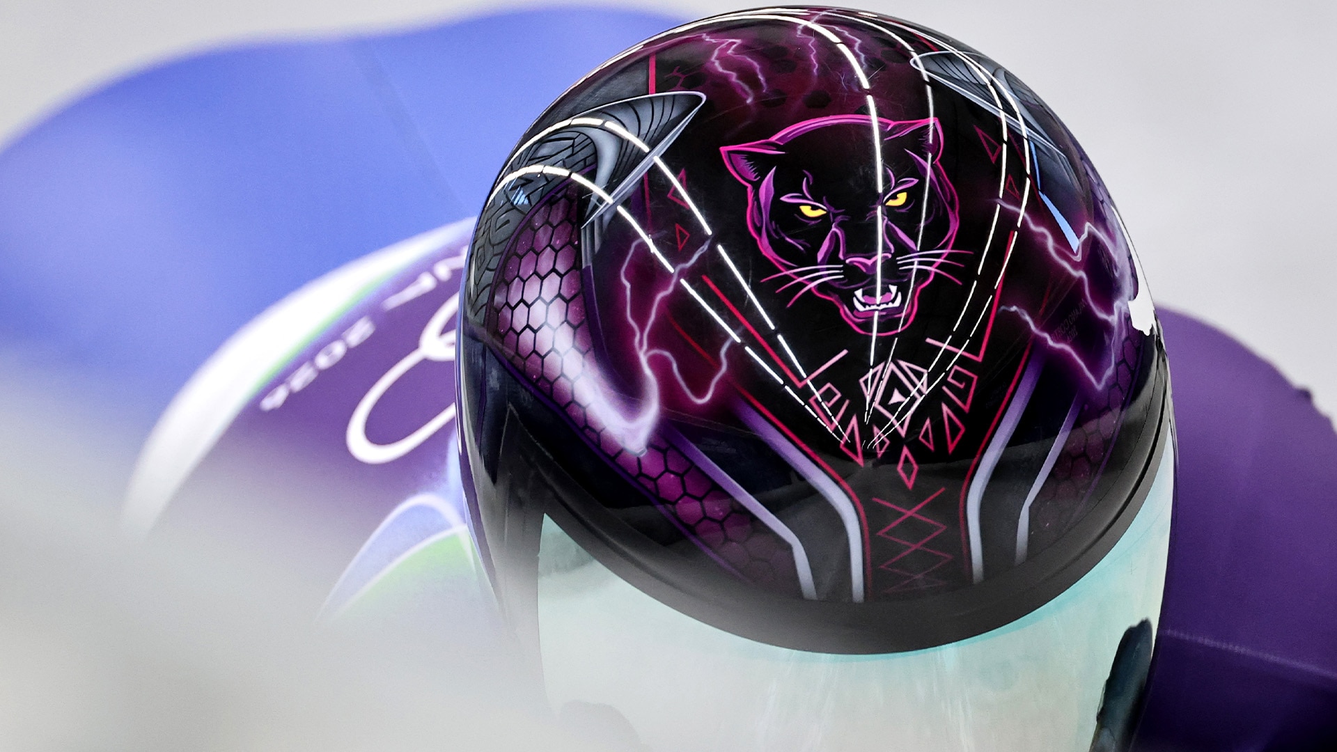 Close-up of Mystique Ro's helmet depicting a panther