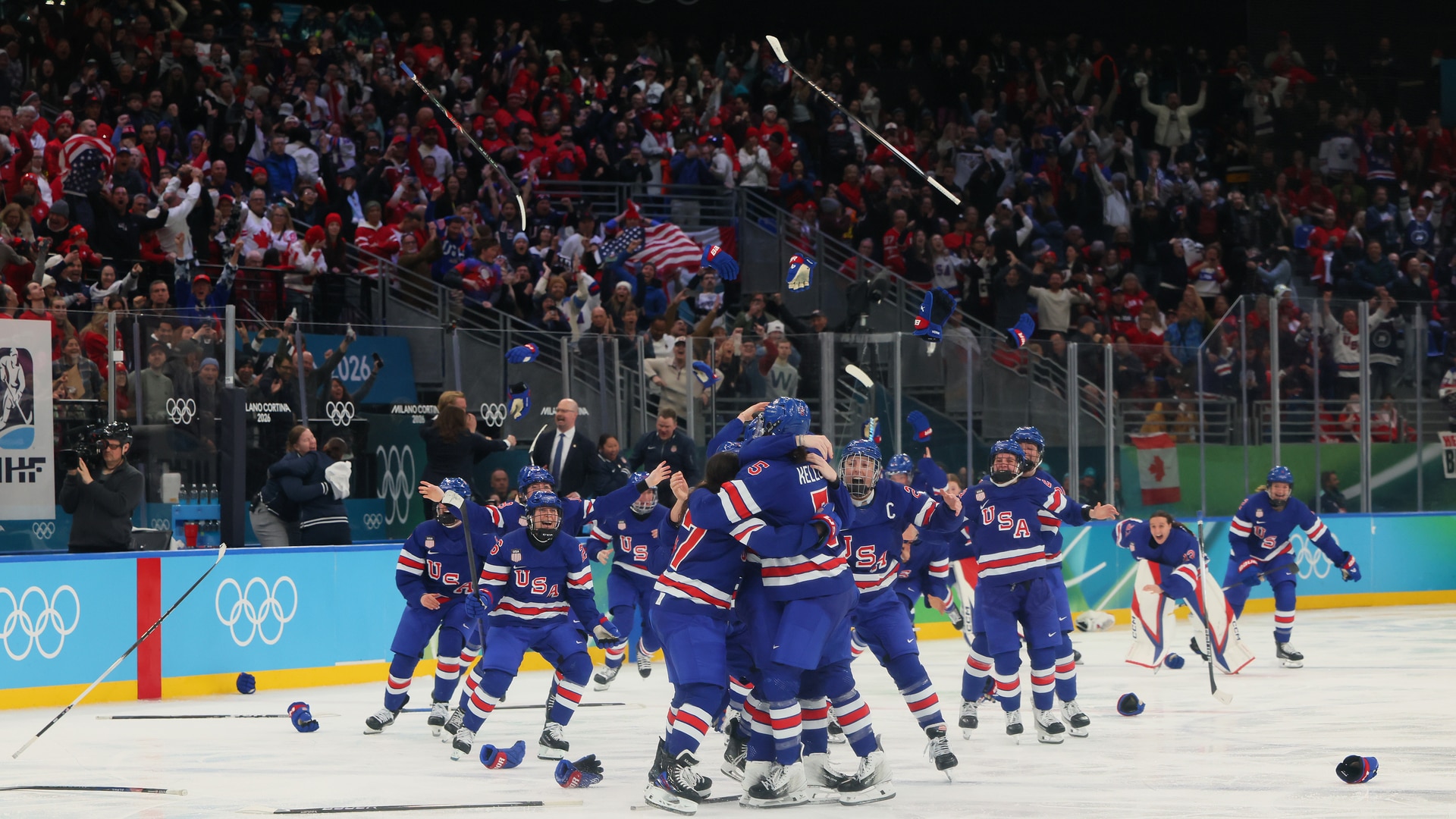 Team USA hugs Megan Keller after she scored the golden goal.