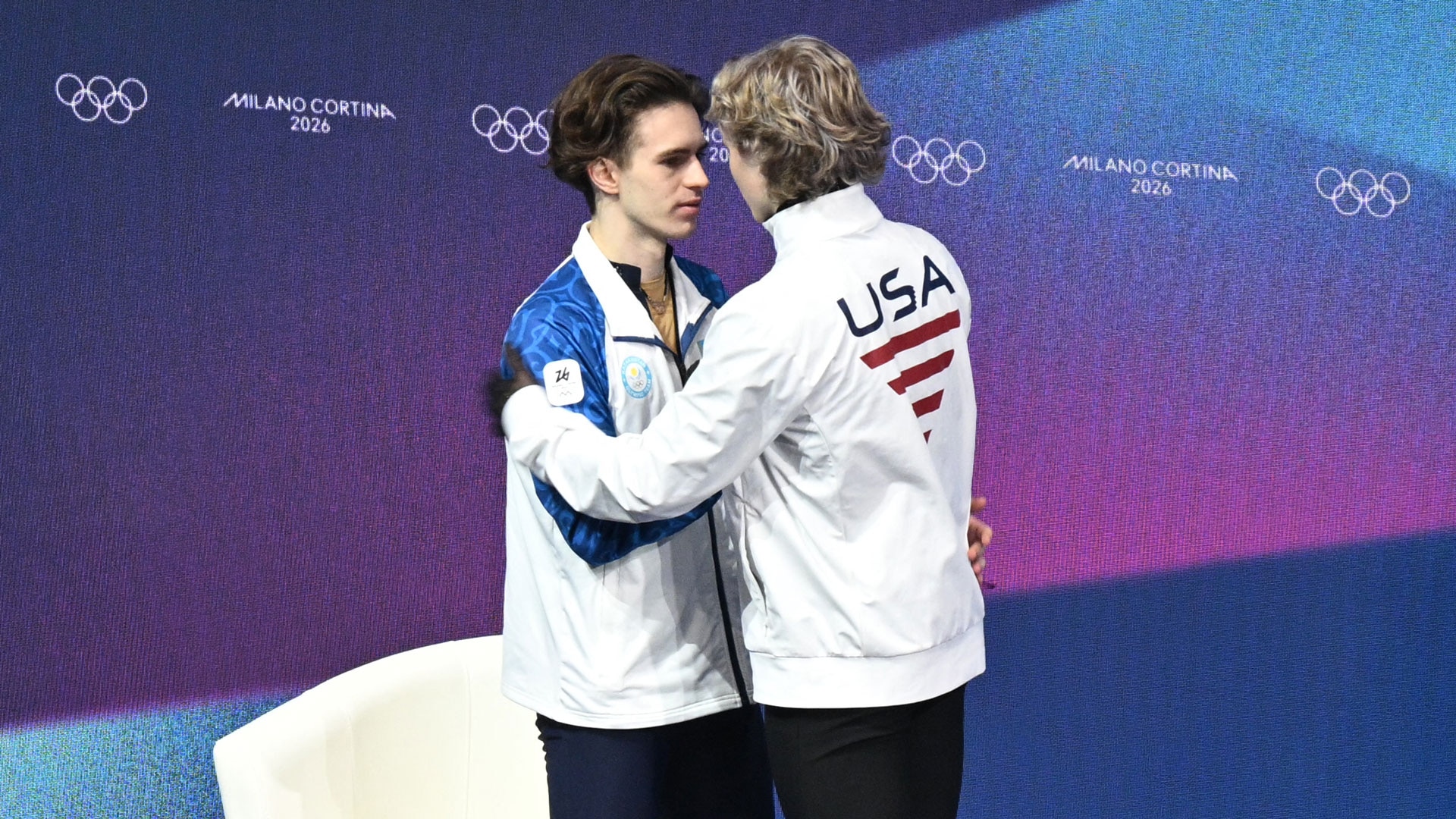 Ilia Malinin congratulates Mikhail Shaidorov on his Olympic gold in men's singles figure skating at the 2026 Winter Olympics. 