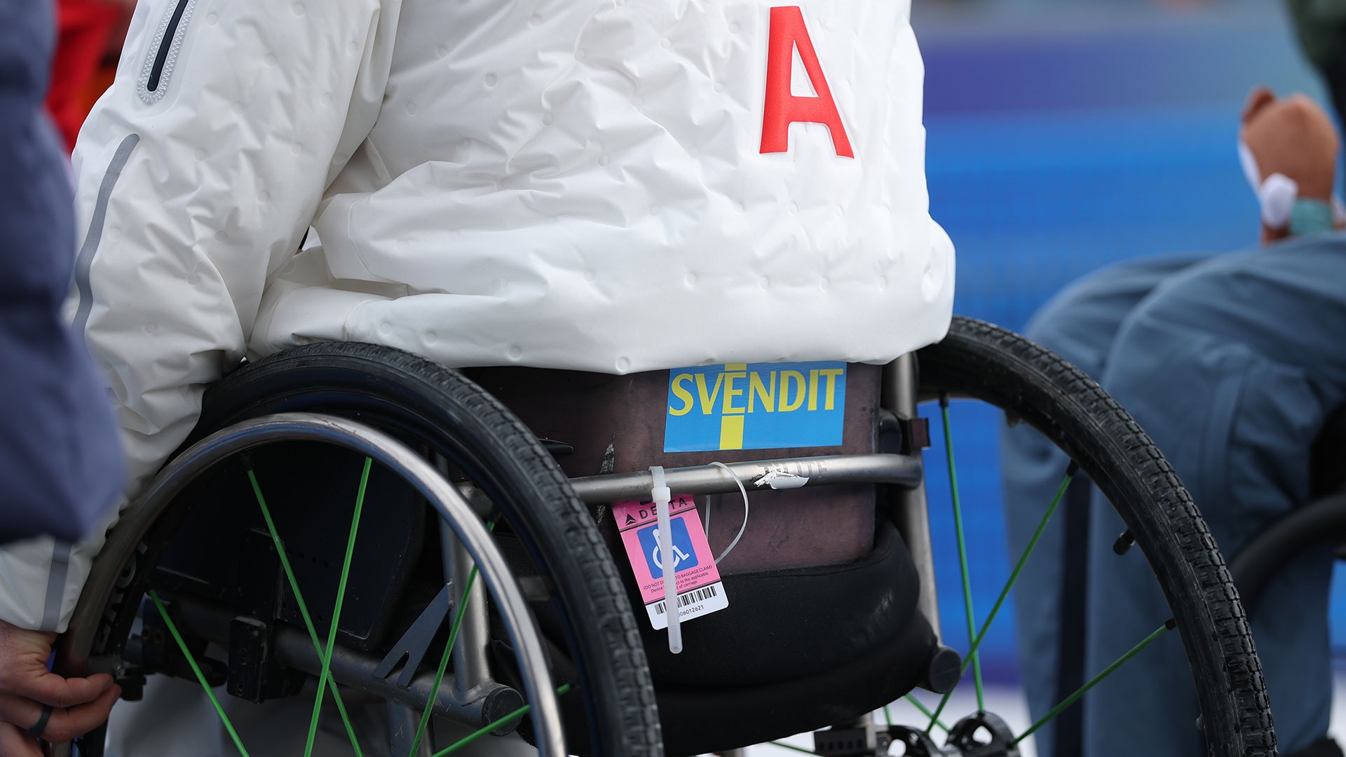 A sticker reading "SvendIt" on the back of Para Alpine skiiner Andrew Kurka's wheelchair 