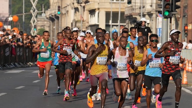 Aug 26, 2023; Budapest, Hungary; Stephen Kissa (UGA), John Hakizmana (RWA), Ogbe Kibrom Ruesom (ERI) and Timothy Kiplagat (KEN) run during the World Athletics Championships Budapest 23 Marathon. Mandatory Credit: Kirby Lee-USA TODAY Sports