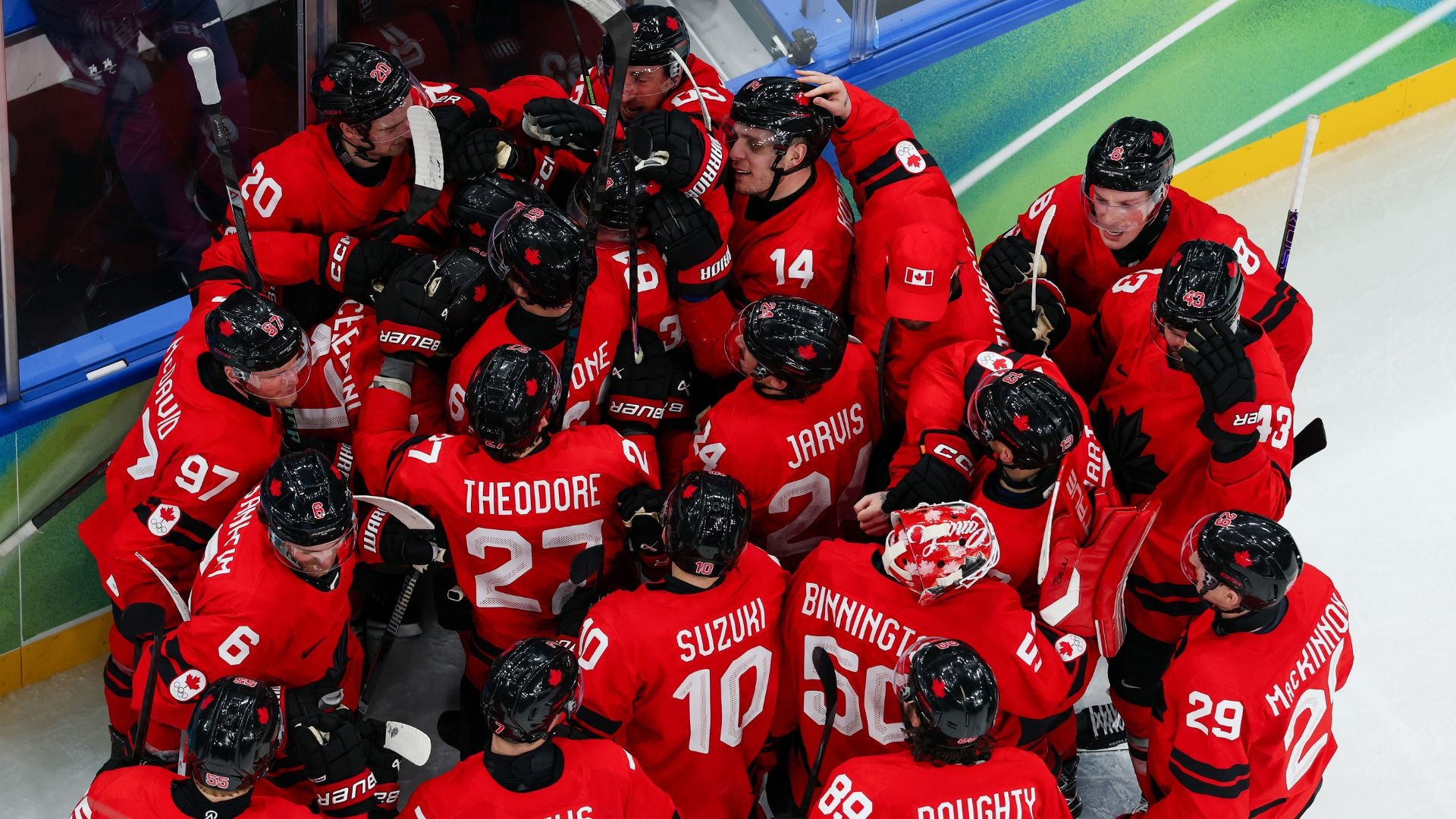 Canada's men's hockey team celebrates after defeating Czechia in the Olympic quarterfinal round.