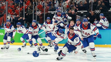 Team USA men's hockey celebrates after winning gold.