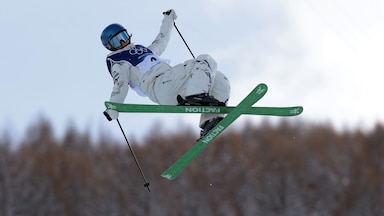 Eileen Gu performs a trick during freestyle skiing competition at the 2026 Milan Cortina Olympics.